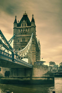 View of bridge over river against buildings