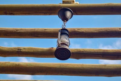 Low angle view of chain against blue sky