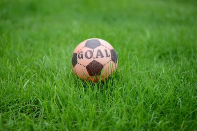 Close-up of soccer ball on field