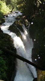 Scenic view of river flowing through rocks