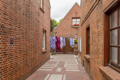 Alley amidst buildings in city