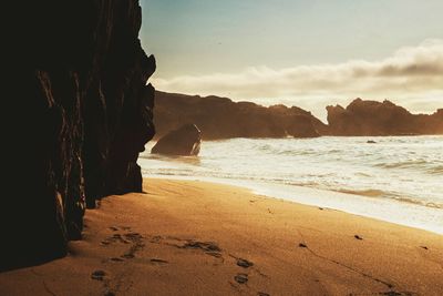 Scenic view of beach against sky in the afternoon 