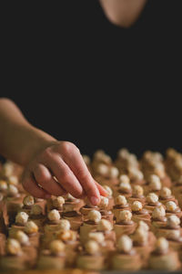 Midsection of person preparing dessert