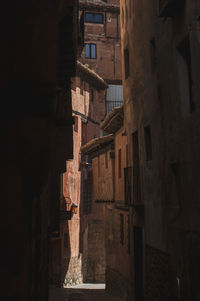 Houses standing by historic building