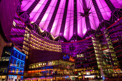 Low angle view of illuminated buildings at night