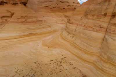 Close up of swirling yellow striped rock formations at ojito wilderness in new mexico