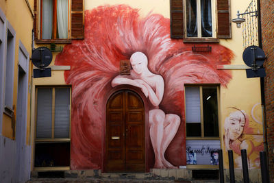 Statue in front of building