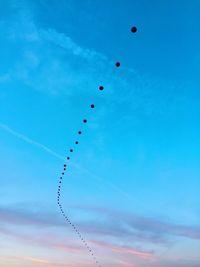 Low angle view of airplane flying in sky