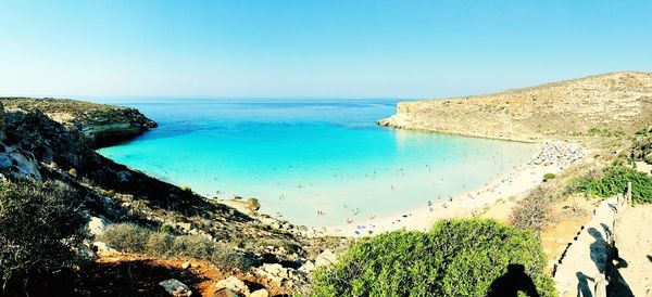 Scenic view of sea against clear blue sky