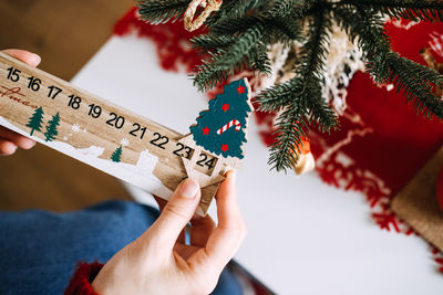 Cropped hand of woman holding gift