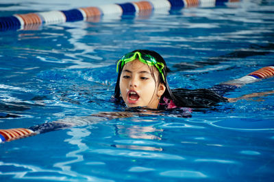 Girl swimming in pool