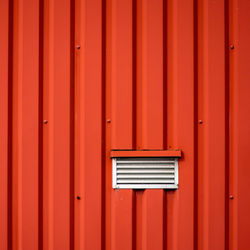 Full frame detail of red door