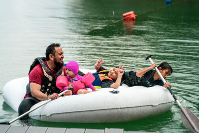 People in boat at lake