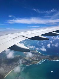 Aerial view of airplane flying in sky