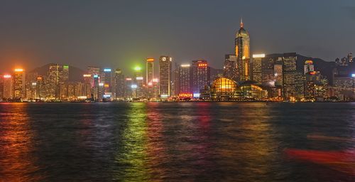 Illuminated buildings in city at night