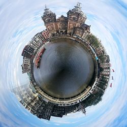 Low angle view of swimming pool in city against sky