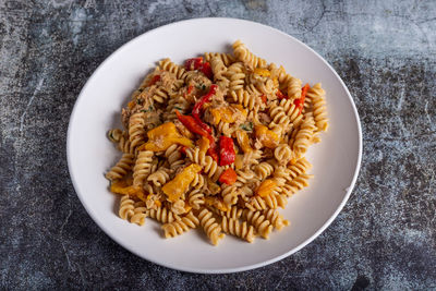 Pasta with peproni, tuna and onion. typical dish of the mediterranean diet