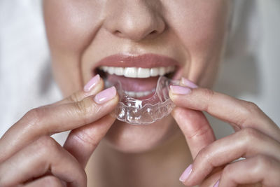 Close-up of woman drinking glass