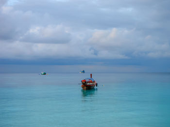 Boat in sea against sky