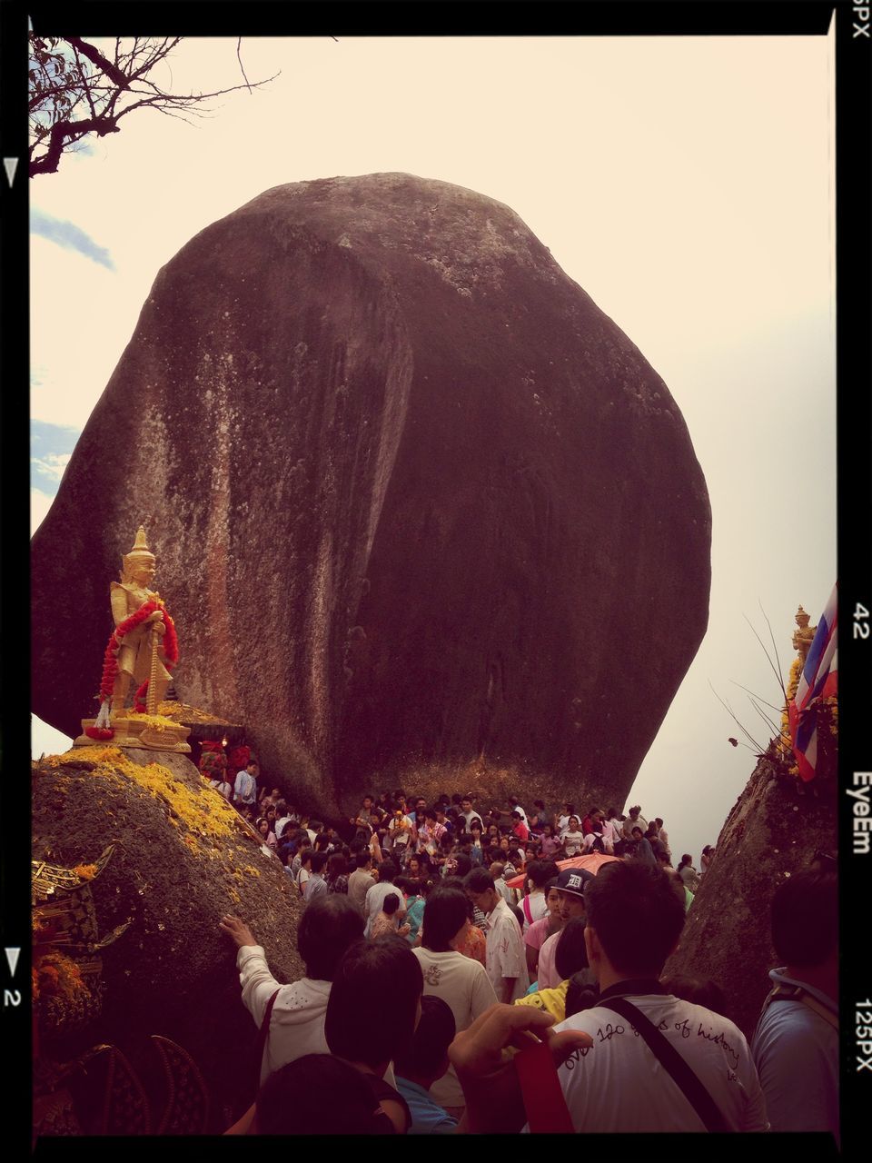 transfer print, large group of people, lifestyles, men, leisure activity, person, crowd, auto post production filter, tourist, mixed age range, tourism, sky, travel destinations, panoramic, travel, famous place, rear view, religion, clear sky