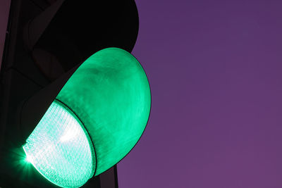 Low angle view of road signal against blue sky