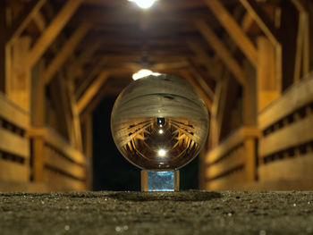 Low angle view of illuminated lighting equipment on building