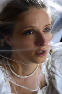 Close-up of young woman in wedding dress