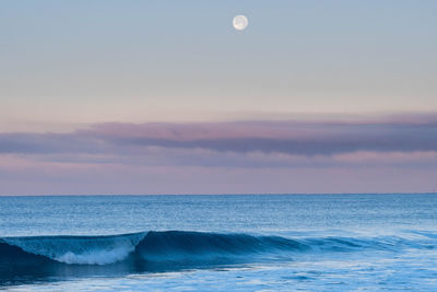 Scenic view of sea against sky at sunset