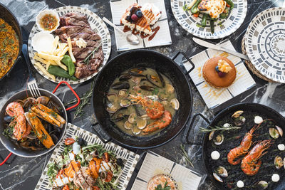  top view of restaurant table with menu of tasty dishes. restaurant menu concept.