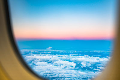 Scenic view of sea seen through airplane window