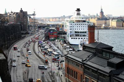 High angle view of traffic on road amidst buildings in city