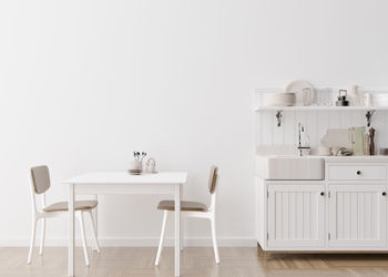 Empty white wall in modern kitchen. mock up interior in minimalist, contemporary style. free space