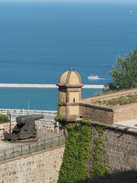 High angle view of building by sea against sky