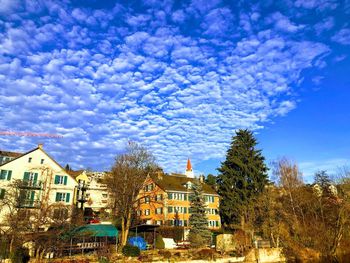 Low angle view of buildings against blue sky