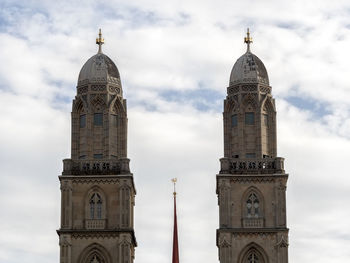 Low angle view of church against cloudy sky