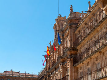 Low angle view of building against blue sky