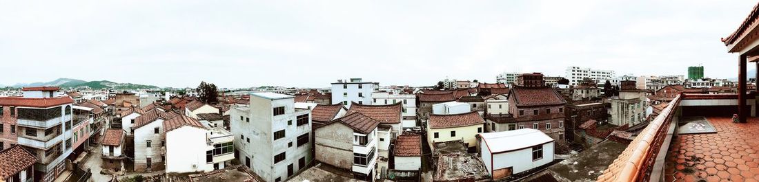 Panoramic view of town against sky