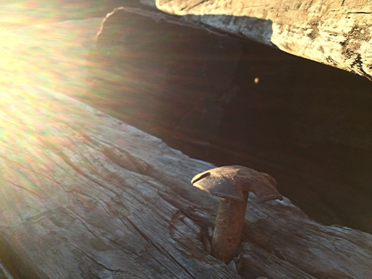 wood - material, high angle view, wooden, wood, indoors, close-up, table, still life, single object, sunlight, brown, no people, textured, day, plank, shadow, pattern, part of, old