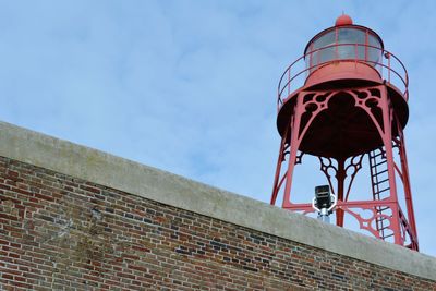 Low angle view of water tower against sky