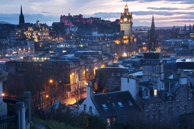 High angle view of buildings in city at night