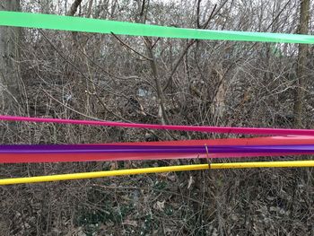 High angle view of multi colored umbrella on field