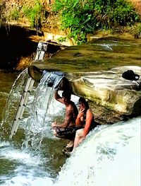 Woman sitting in water