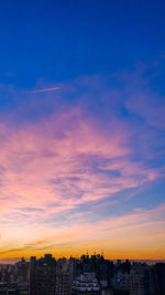 High angle view of buildings against sky during sunset
