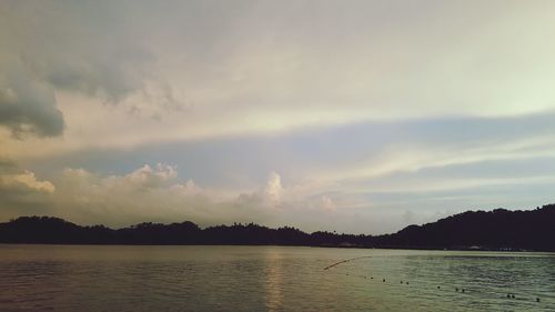 Scenic view of sea against dramatic sky