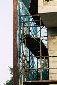 Low angle view of abandoned building against sky