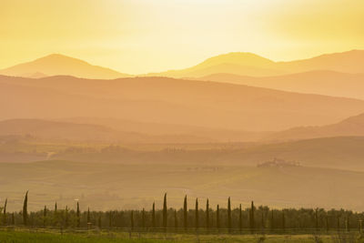 Scenic view of landscape against sky during sunset