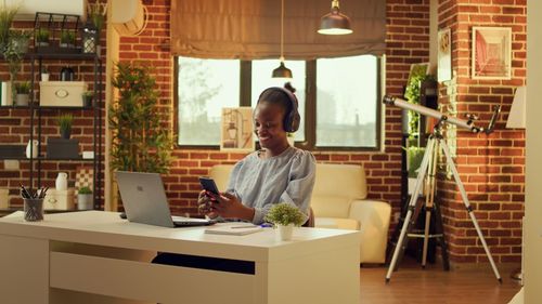 Young man using digital tablet while sitting at home