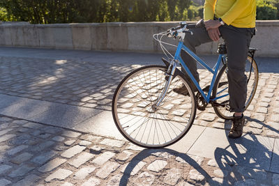 Unrecognizable man riding bicycle in the city