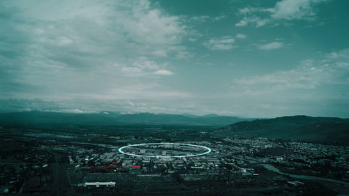 High angle view of city against cloudy sky