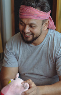 Portrait of a bearded man wearing headscarf on his head. asian culture.